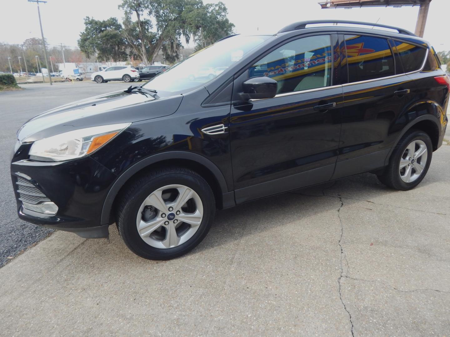 2016 Black /Gray Ford Escape SE (1FMCU0GXXGU) with an 1.6l engine, Automatic transmission, located at 3120 W Tennessee St, Tallahassee, FL, 32304-1002, (850) 575-6702, 30.458841, -84.349648 - Used Car Supermarket is proud to present you with this loaded immaculate 2016 Ford Escape SE. Used Car Supermarket prides itself in offering you the finest pre-owned vehicle in Tallahassee. Used Car Supermarket has been locally family owned and operated for over 48 years. Our Escape SE has been serv - Photo#1